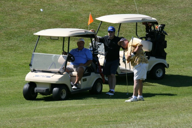 A golfer participates in a tournament at Whispering Pines