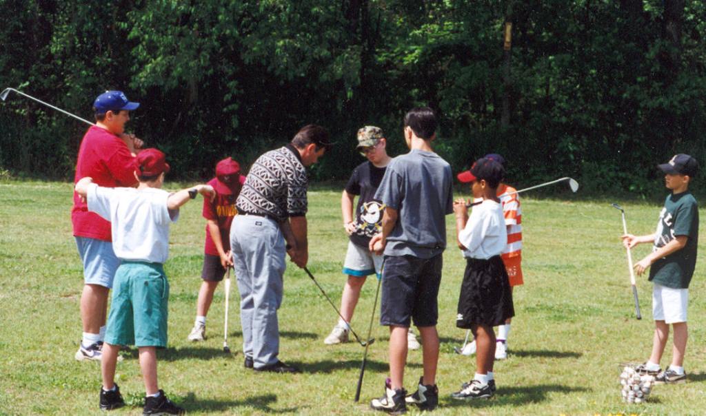 Kids participate in a junior golf program at Whispering Pines