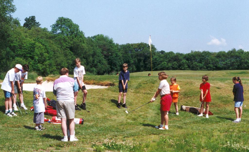 Kids participate in a junior golf program at Whispering Pines