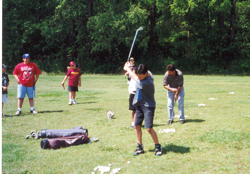 Kids participate in a junior golf program at Whispering Pines